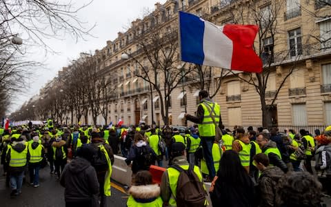 Demonstrators from the "Yellow Vests" movement march in Paris on Saturday January 26 - Credit: Anita Puchard Serra&nbsp;/Bloomberg