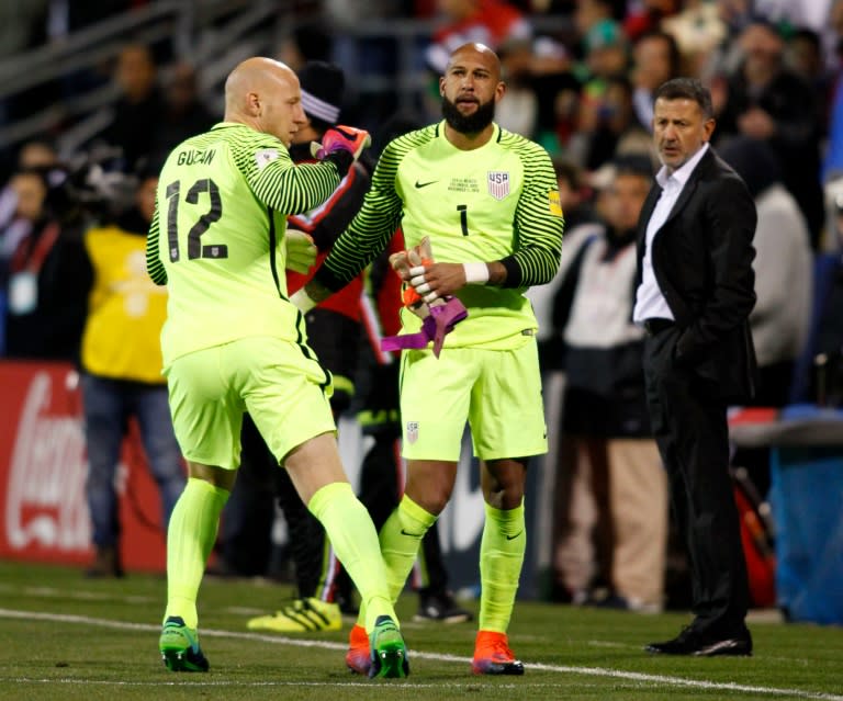 The US national football team goalkeeper Tim Howard (R) leaves the field as Brad Guzan takes his place during their 2018 FIFA World Cup qualifying match against Mexico, in Columbus, Ohio, on November 11, 2016