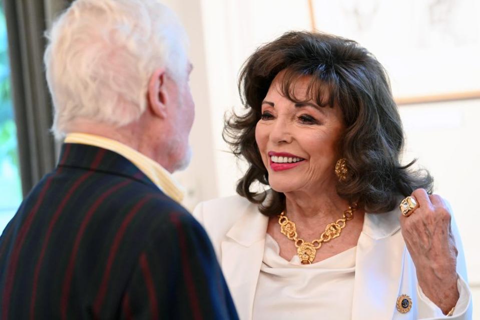  Sir Derek Jacobi and Dame Joan Collins