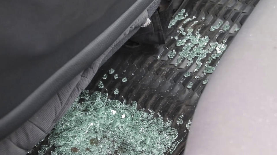 In this image taken from video, broken glass sits in the footwell of the vehicle in which the Italian ambassador to Congo was killed, according to those at the scene, in Nyiragongo, North Kivu province, Congo Monday, Feb. 22, 2021. The Italian ambassador to Congo Luca Attanasio, an Italian carabineri police officer and their Congolese driver were killed Monday in an attack on a U.N. convoy in an area that is home to myriad rebel groups, the Foreign Ministry and local people said. (AP Photo/Justin Kabumba)