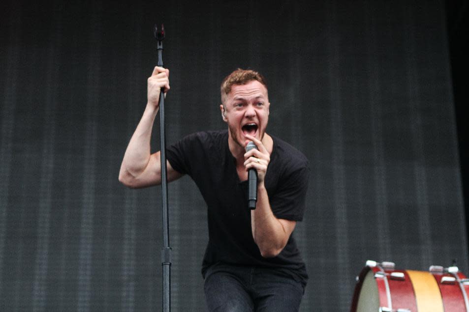 FILE - This Sept. 21, 2013 file photo shows Dan Reynolds of Imagine Dragons performing as part of Music Midtown 2013 at Piedmont Park in Atlanta. Imagine Dragons are part of a breed of newer and lesser known acts who are able to sell out top venues, even if they aren’t selling millions of albums and singles, or dominating with chart-topping tracks and radio airplay. (Photo by Robb D. Cohen/Invision/AP, File)