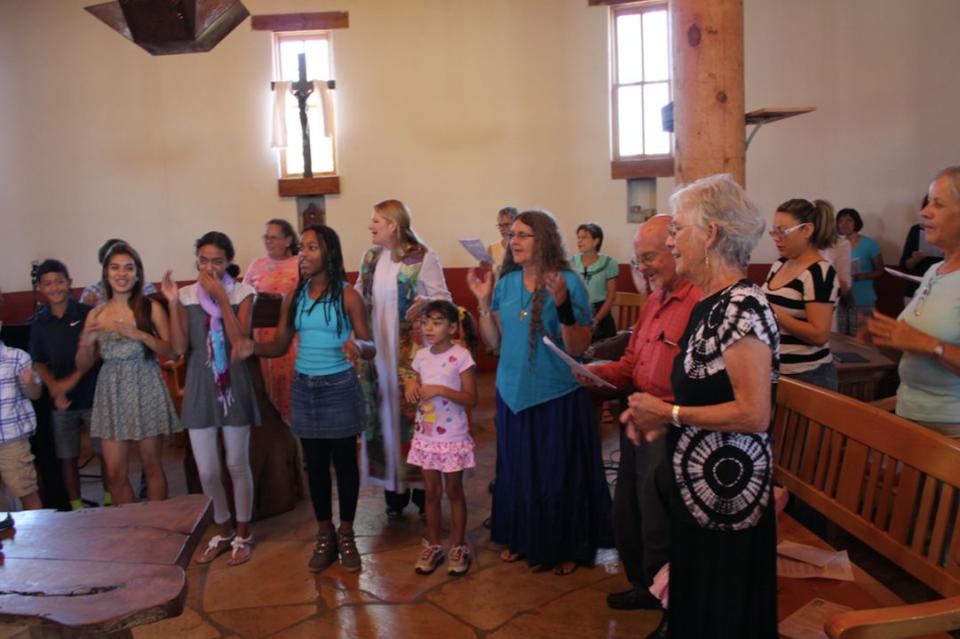 Rev. Alison Harrington (center, in white robe) leading&nbsp;her congregation in worship at Southside Presbyterian Church in Tucson, Arizona,&nbsp;in 2013. (Photo: Southside Presbyterian Church)