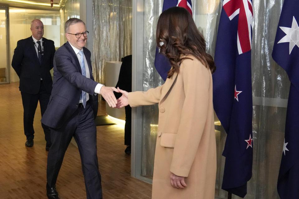 New Zealand Prime Minister Jacinda Ardern, right, is greeted by Australian Prime Minister Anthony Albanese ahead of a bilateral meeting in Sydney, Australia, Friday, June 10, 2022. Ardern is on a two-day visit to Australia. (AP Photo/Mark Baker, Pool)
