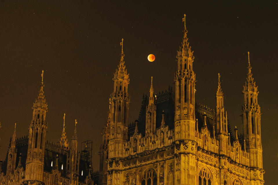 A&nbsp;super blood moon rises over the spires of the House of Parliament on September 28, 2015, in London, United Kingdom. (Photo: Joseph Okpako via Getty Images)