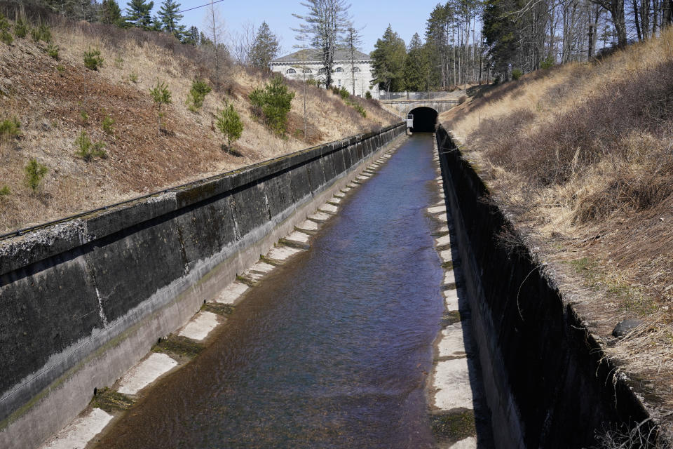 Water from the Ashokan Reservoir, about 10 million gallons a day, runs through the release channel in Olive, N.Y., Tuesday, April 5, 2022. The channel can handle a flow of up to 600 million gallons per day. As western regions contend with drier conditions, New York City is under fire for sometimes releasing hundreds of millions of gallons of water a day from the reservoir in the Catskill Mountains. The occasional releases, often around storms, have been used to manage water the reservoir's levels and to keep the water clear. But residents downstream say the periodic surges cause ecological harm along the lower Esopus Creek. (AP Photo/Seth Wenig)