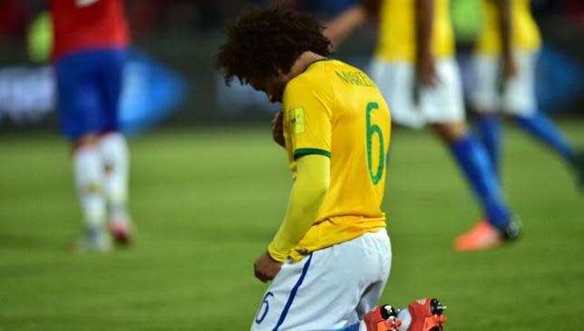 Brazilian defender Marcelo prays after his country's 2-0 defeat.