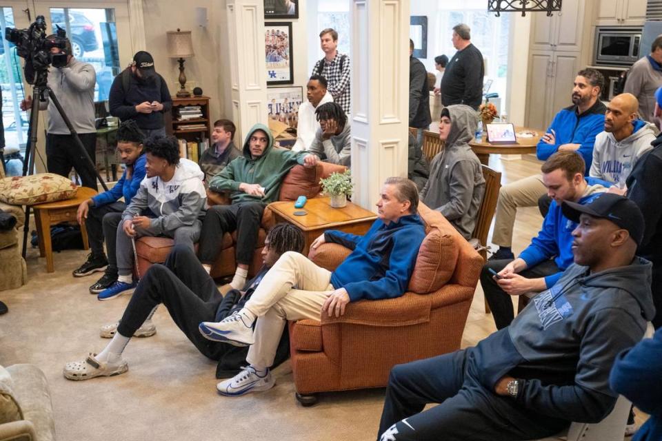 Kentucky Wildcats head coach John Calipari sits with his team and staff waiting to find out their ranking and opponent for the NCAA Men’s Basketball tournament at John Calipari’s house in Lexington, Ky., Sunday, March 12, 2023.