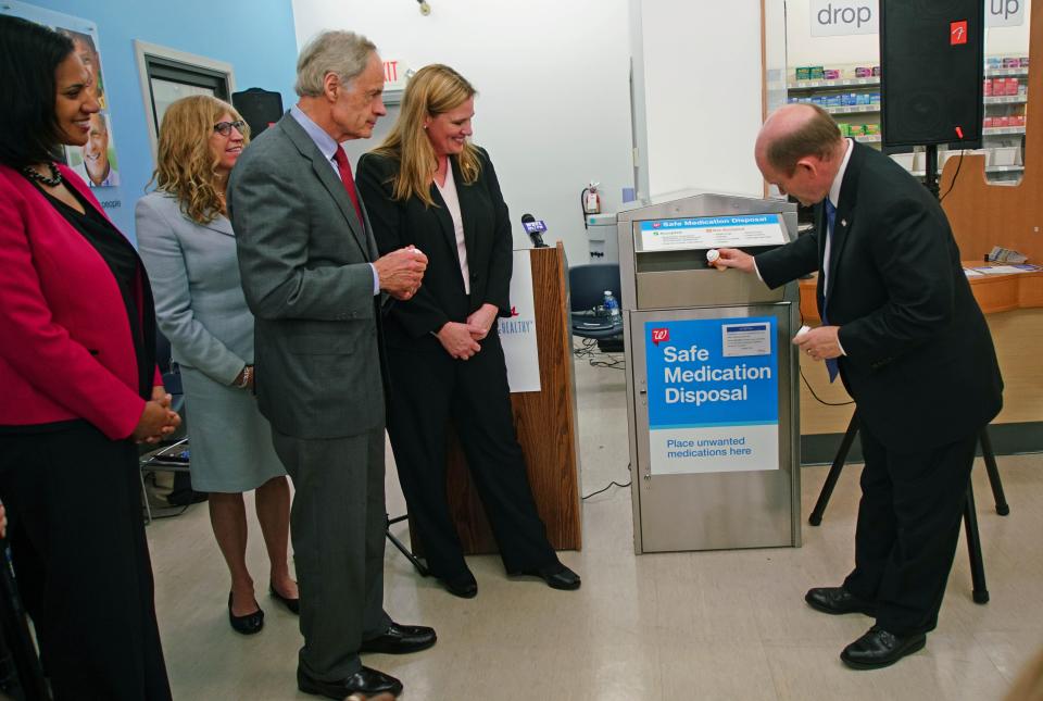 Many pharmacies have boxes for people to dispose of unwanted or old prescription medications. In this file photo, Sen. Chris Coons demonstrates how to discard old prescription drugs in a box at the Walgreens in Fairfax Shopping Center.