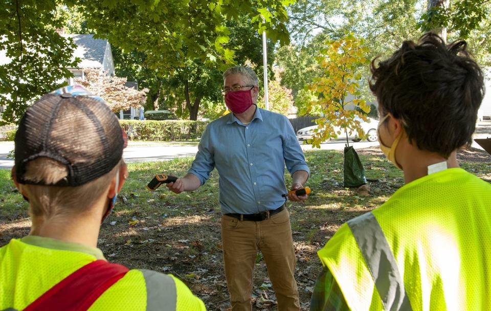 Clark professor John Rogan talks to students at the university's Hadwen Arboretum in Worcester in 2020.