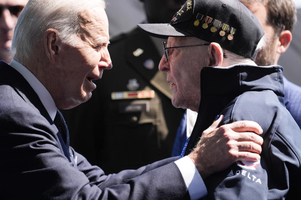 President Joe Biden greets a World War II veteran during ceremonies to mark the 80th anniversary of D-Day, Thursday, June 6, 2024, in Normandy. (AP Photo/Evan Vucci)