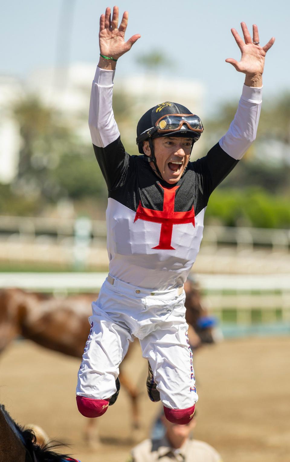 Dettori executes his famous dismount after victory on Nothing Like You