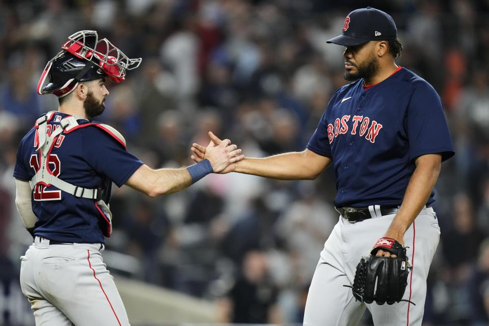 Boston Red Sox relief pitcher Kenley Jansen, right, celebrates with catcher Connor Wong (12) after the team's 3-2 win in a baseball game against the New York Yankees on Friday, June 9, 2023, in New York. (AP Photo/Frank Franklin II)