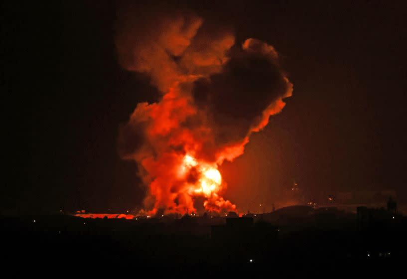 A fire rages following an Israeli air strike overnight on the southern Gaza region of Khan Yunis, controlled by the Hamas movement, early on May 11, 2021. - Israel launched deadly air strikes on Gaza in response to a barrage of rockets fired by the Islamist movement Hamas amid spiralling violence sparked by unrest at Jerusalem's Al-Aqsa Mosque compound. (Photo by SAID KHATIB / AFP) (Photo by SAID KHATIB/AFP via Getty Images)