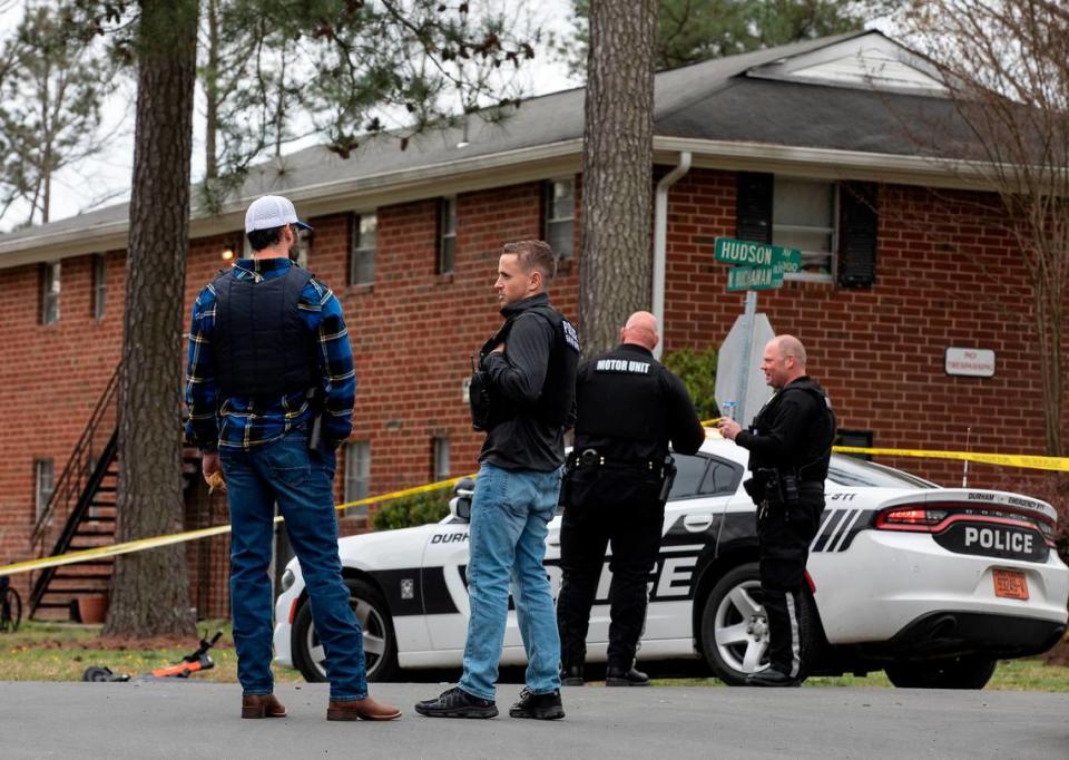 Law enforcement investigate a homicide near the intersection of Hudson Avenue and North Buchanan Boulevard on Wednesday, March 22, 2023, in Durham, N.C. Kaitlin McKeown/kmckeown@newsobserver.com