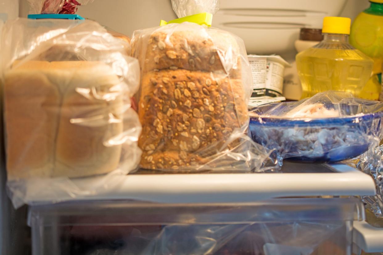 Inside a Home Fridge with bread and other articles-  with fridge lighting.