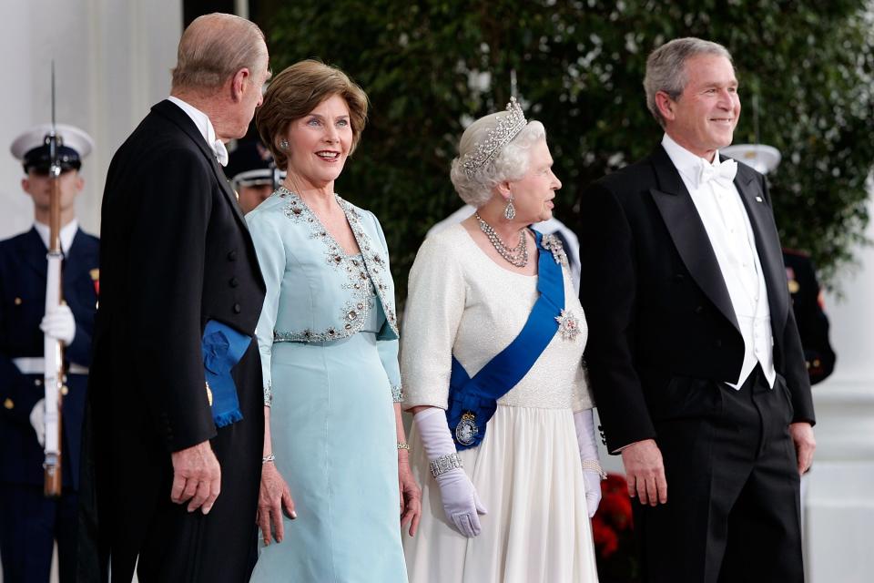 President George W. Bush and first lady Laura Bush greet Queen Elizabeth and Prince Philip at a state dinner at the White House in 2007.