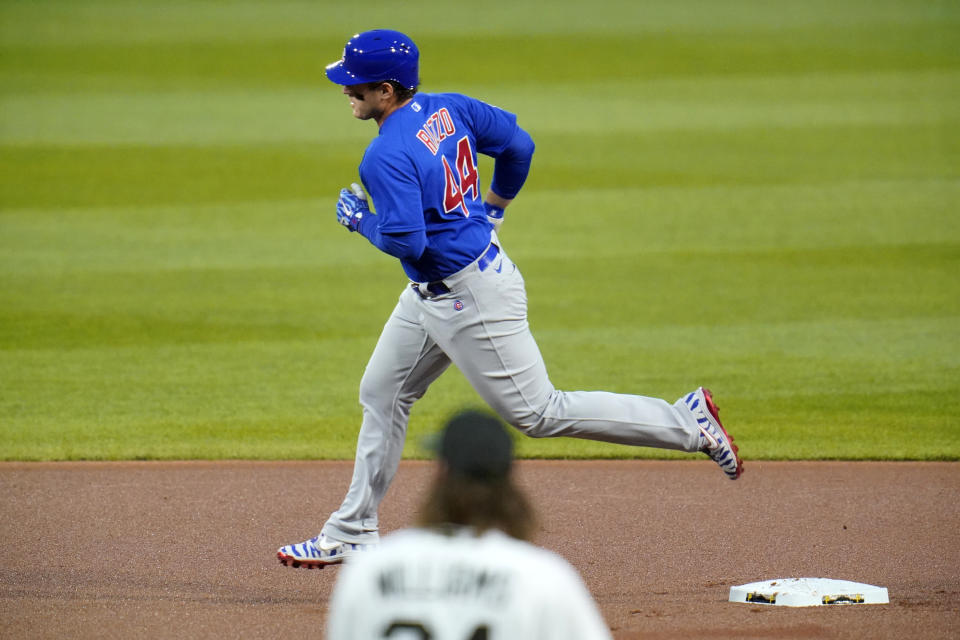 Chicago Cubs' Anthony Rizzo (44) rounds second after hitting a solo home run off Pittsburgh Pirates starting pitcher Trevor Williams, bottom, during the first inning of a baseball game in Pittsburgh, Wednesday, Sept. 23, 2020. (AP Photo/Gene J. Puskar)