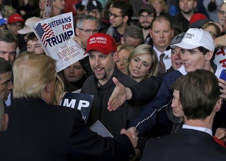 U.S. Republican presidential candidate Donald Trump greets supporters at a campaign rally in Bloomington, Illinois, March 13, 2016. REUTERS/Jim Young