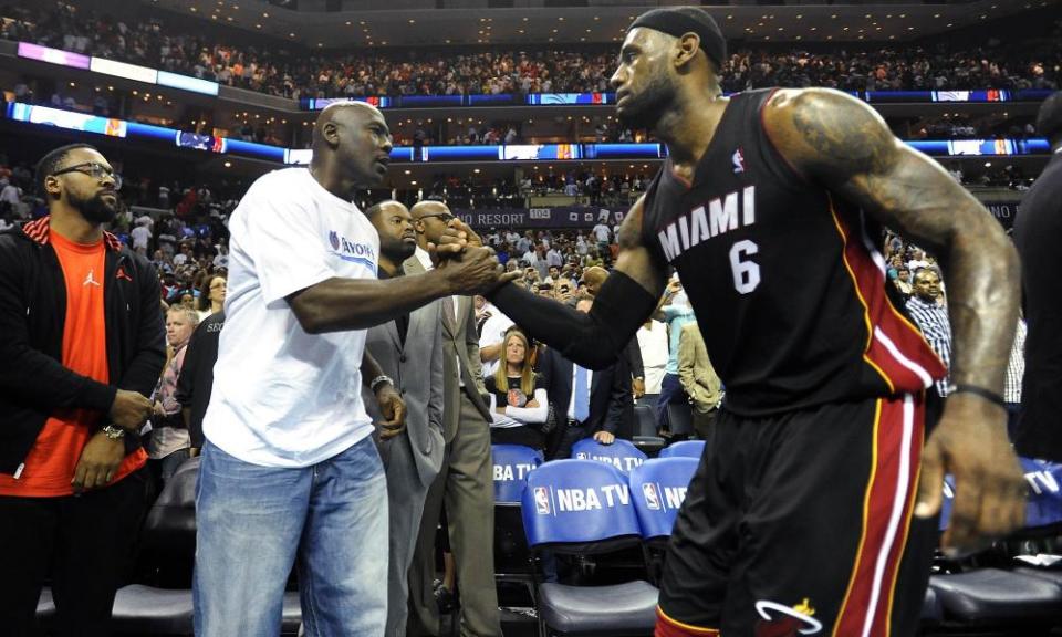 Michael Jordan and LeBron James greet each other during James’s time with the Miami Heat in 2014