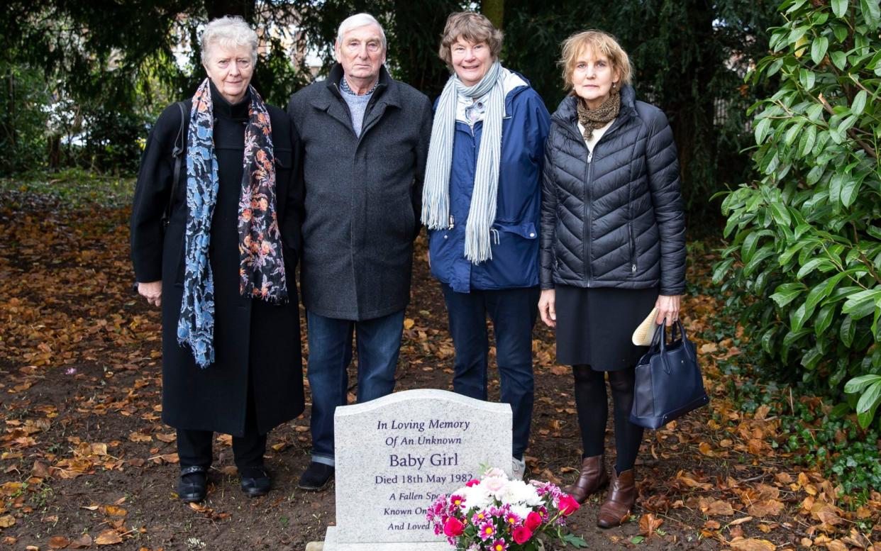 The Far Cotton community gather around a new headstone for a murdered baby girl who died on the 18th May 1982