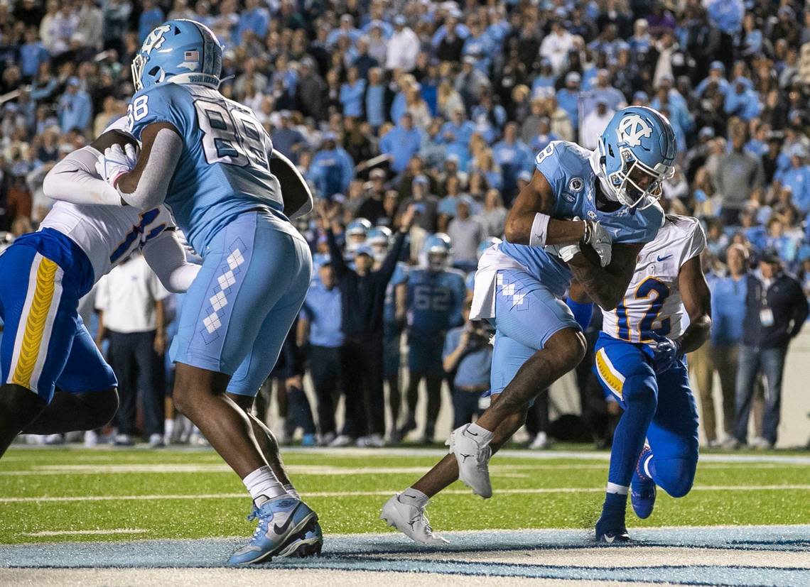 North Carolina wide receiver Kobe Paysour (8) scores a touchdown on a one-yard pass from quarterback Drake Maye in the second quarter against Pitt on Saturday, October 29, 2022 at Kenan Stadium in Chapel Hill, N.C.