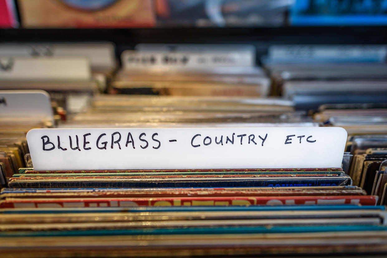 A selection of Bluegrass and Country vinyl albums for sale in a second hand store.