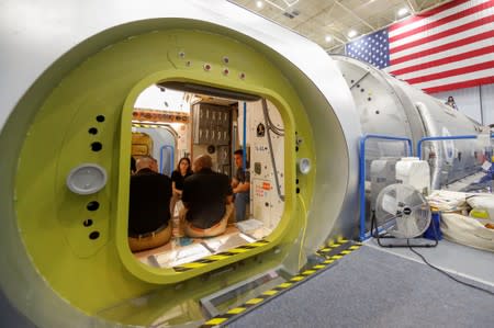 NASA commercial crew astronauts Michael Hopkins and Victor Glover run through a training session at a replica International Space Station (ISS) at the Johnson Space Center in Houston, Texas