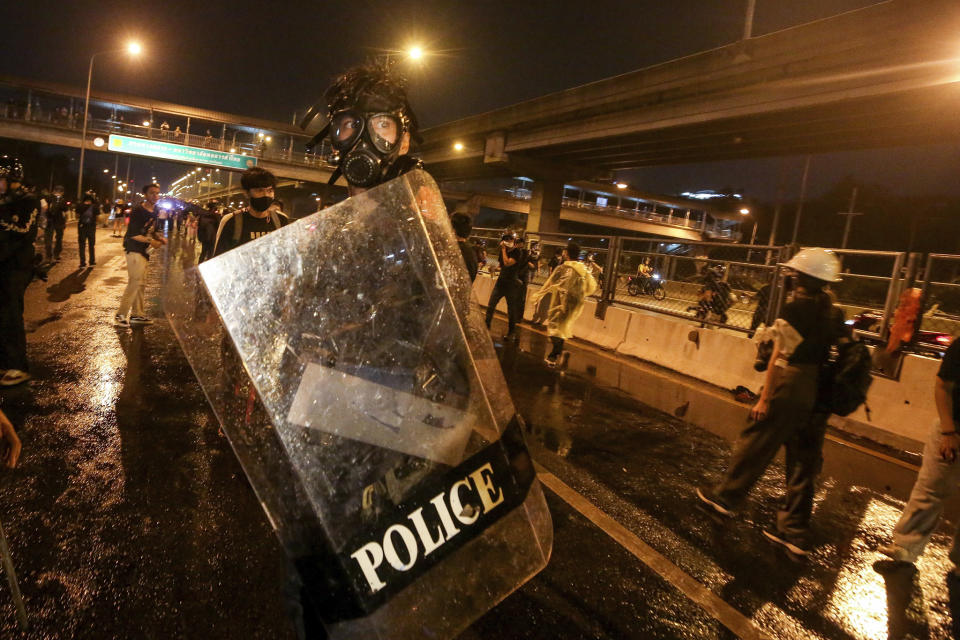 Police react with protesters during a protest in Bangkok, Thailand, Sunday, Feb. 28, 2021. (AP Photo)