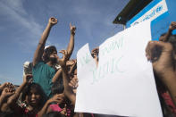 Rohingya refugees shout slogans during a protest against the repatriation process at Unchiprang refugee camp near Cox's Bazar, in Bangladesh, Thursday, Nov. 15, 2018. The head of Bangladesh's refugee commission said plans to begin a voluntary repatriation of Rohingya Muslim refugees to their native Myanmar on Thursday were scrapped after officials were unable to find anyone who wanted to return. (AP Photo/Dar Yasin)