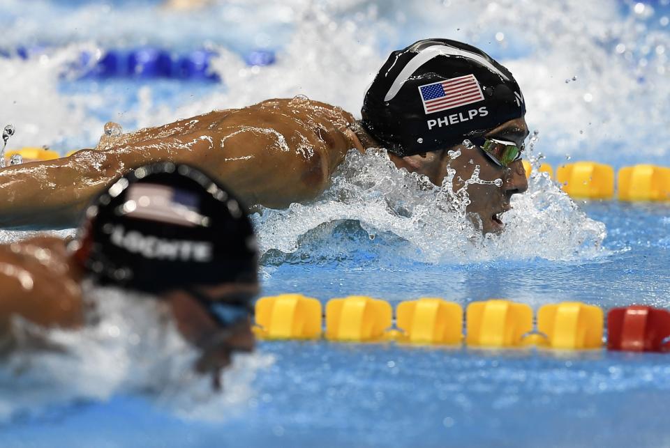 United States' Ryan Lochte and United States' Michael Phelps, right, compete during a men's 200-meter individual medley semifinal during the swimming competitions at the 2016 Summer Olympics, Wednesday, Aug. 10, 2016, in Rio de Janeiro, Brazil. (AP Photo/Martin Meissner)