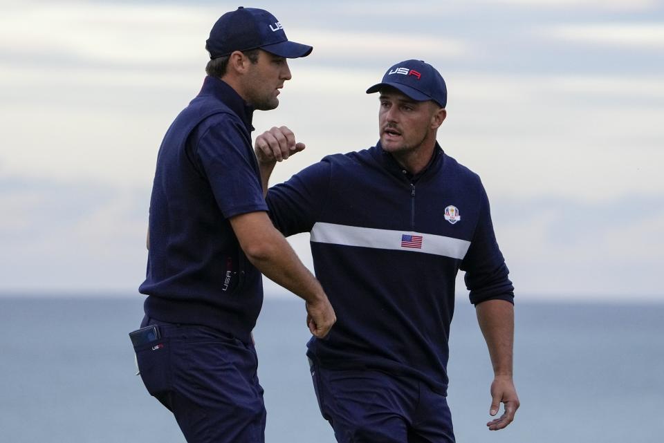 Team USA's Bryson DeChambeau and Team USA's Scottie Scheffler during a four-ball match the Ryder Cup at the Whistling Straits Golf Course Saturday, Sept. 25, 2021, in Sheboygan, Wis. (AP Photo/Jeff Roberson)