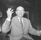 FILE - In this April 5, 1962 file photo Bela Guttmann, Hungarian-born soccer coach of European Cup holders Benfica of Portugal, gestures as he is interviewed by journalists in a hotel in London. B is for Benfica. In this case the 'Curse of Benfica.' Guttmann reportedly approached the Benfica board of directors and asked for a pay rise after leading them to their second European Cup triumph. However, despite the success he had brought the club, he was turned down. On leaving Benfica, he allegedly cursed the club declaring, "Not in a hundred years from now will Benfica ever be European champions". Benfica have not won a European trophy since, despite getting to the final on numerous occasions. (AP Photo/Leonard Brown, File)