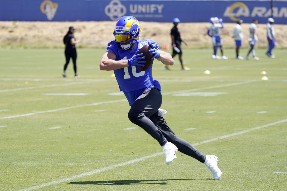 Los Angeles Rams wide receiver Cooper Kupp makes a catch at the NFL football team's practice facility Monday, May 23, 2022, in Thousand Oaks, Calif. (AP Photo/Marcio Jose Sanchez)
