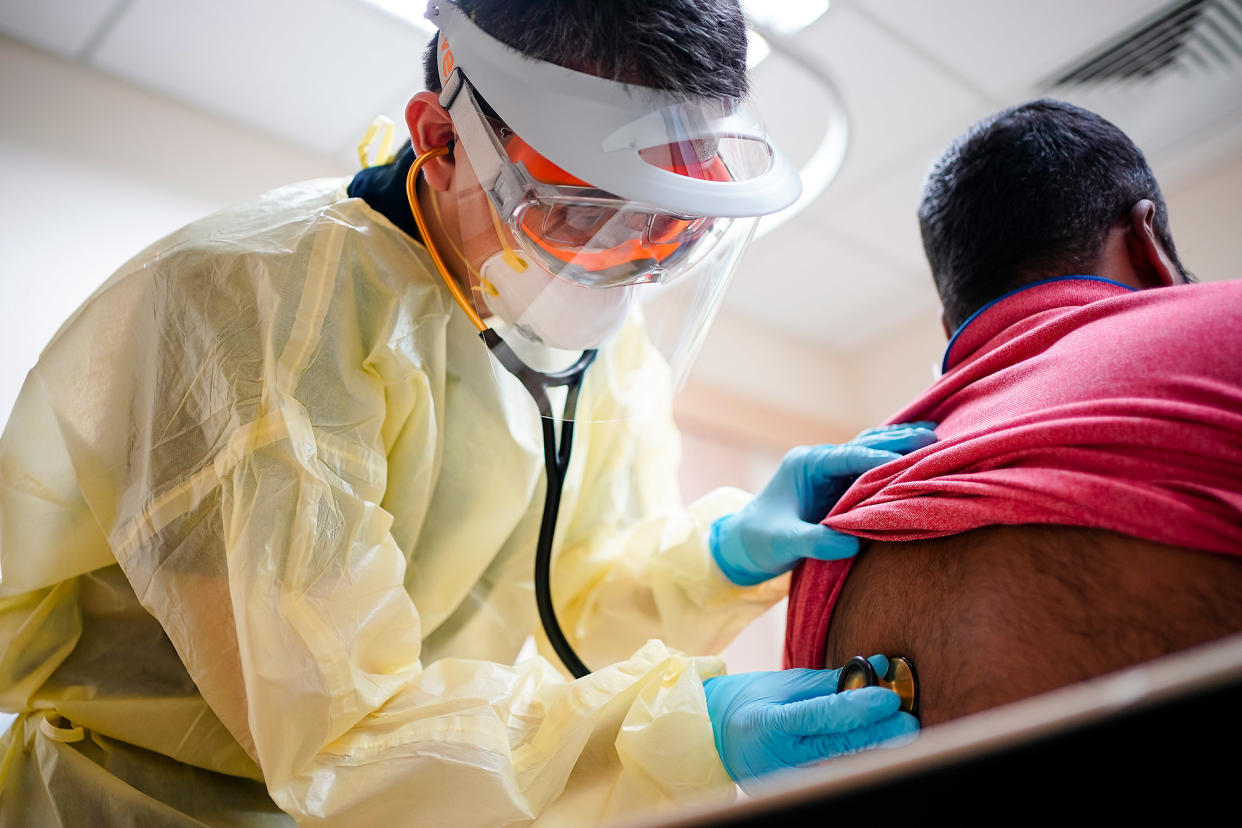 Dr Chua Ying Xian, deputy head of Pioneer Polyclinic, examines a patient. PHOTO: National University Health System