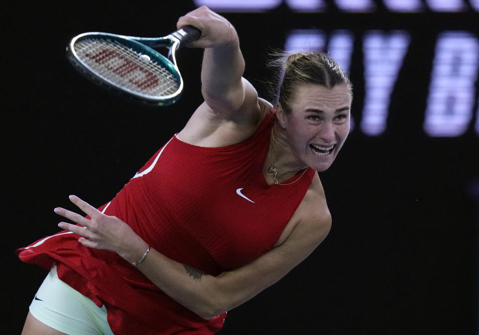 FILE - Aryna Sabalenka, of Belarus, serves to Zheng Qinwen, of China, during the women's singles final at the Australian Open tennis championships at Melbourne Park in Melbourne, Australia, Saturday, Jan. 27, 2024. Sabalenka won the year’s first Grand Slam tournament, the Australian Open, and is among the favorites at the 2024 French Open, which starts Sunday at Roland Garros in Paris. (AP Photo/Andy Wong, File)