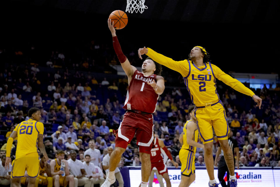 Alabama guard Mark Sears (1) shoots against LSU guard Mike Williams III (2) during the first half of an NCAA college basketball game in Baton Rouge, La., Saturday, Feb. 10, 2024. (AP Photo/Matthew Hinton)