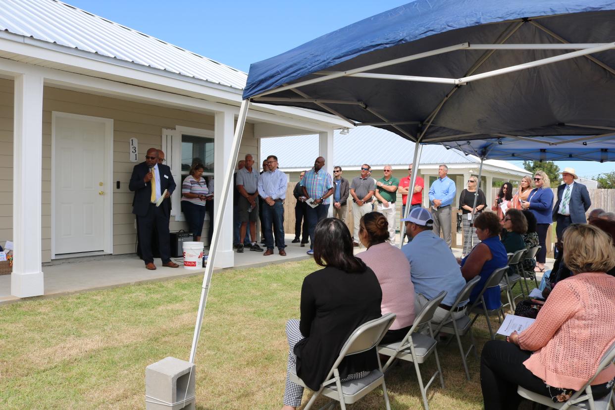 Dozens gathered Wednesday afternoon for Habitat for Humanity of Bay County's 100th home dedication.