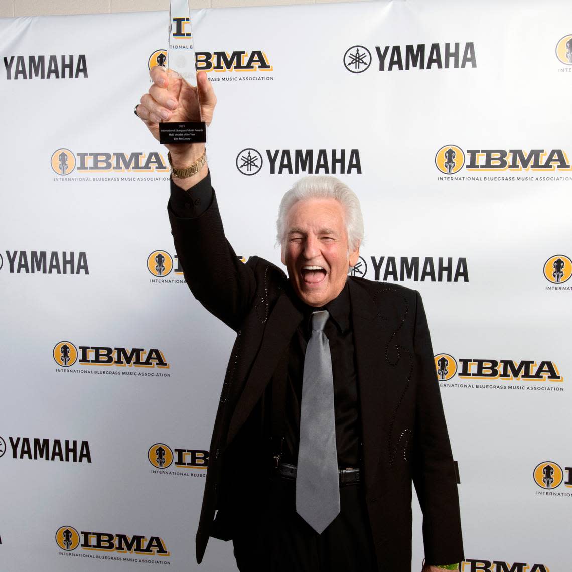 Del McCoury celebrates after sharing the Vocalist of the Year award at the 32nd Annual IBMA Bluegrass Music Awards in Raleigh, N.C., Thursday night, Sept. 30, 2021.
