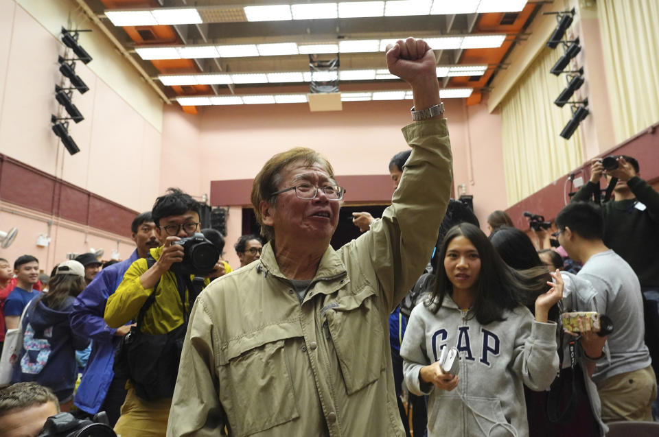 Supporters of a pro-democracy candidate cheer after winning their seat in district council elections in Hong Kong, early Monday, Nov. 25, 2019. Voters in Hong Kong turned out in droves on Sunday in district council elections seen as a barometer of public support for pro-democracy protests that have rocked the semi-autonomous Chinese territory for more than five months. (AP Photo/Vincent Yu)