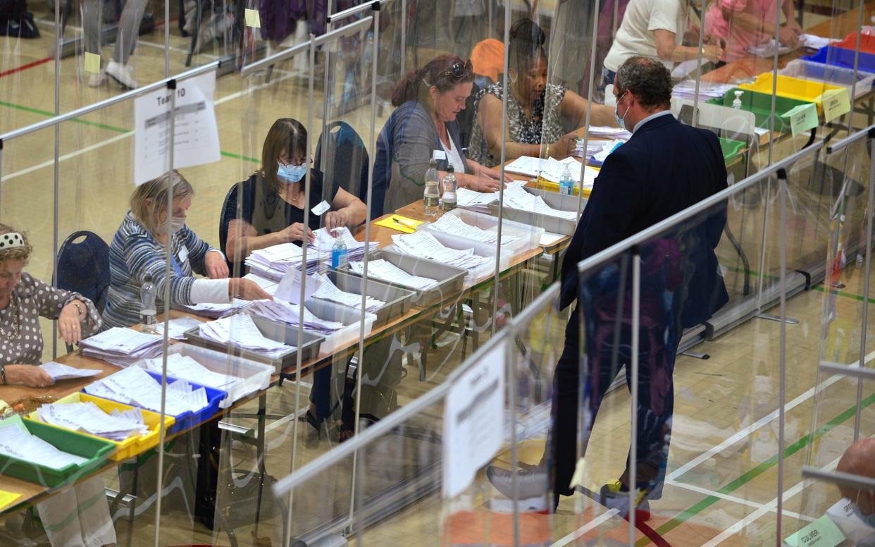 Election officials count the ballots in the Chesham and Amersham By-Election at Chesham Leisure Centre on June 17, 2021 - Jim Dyson/Getty Images