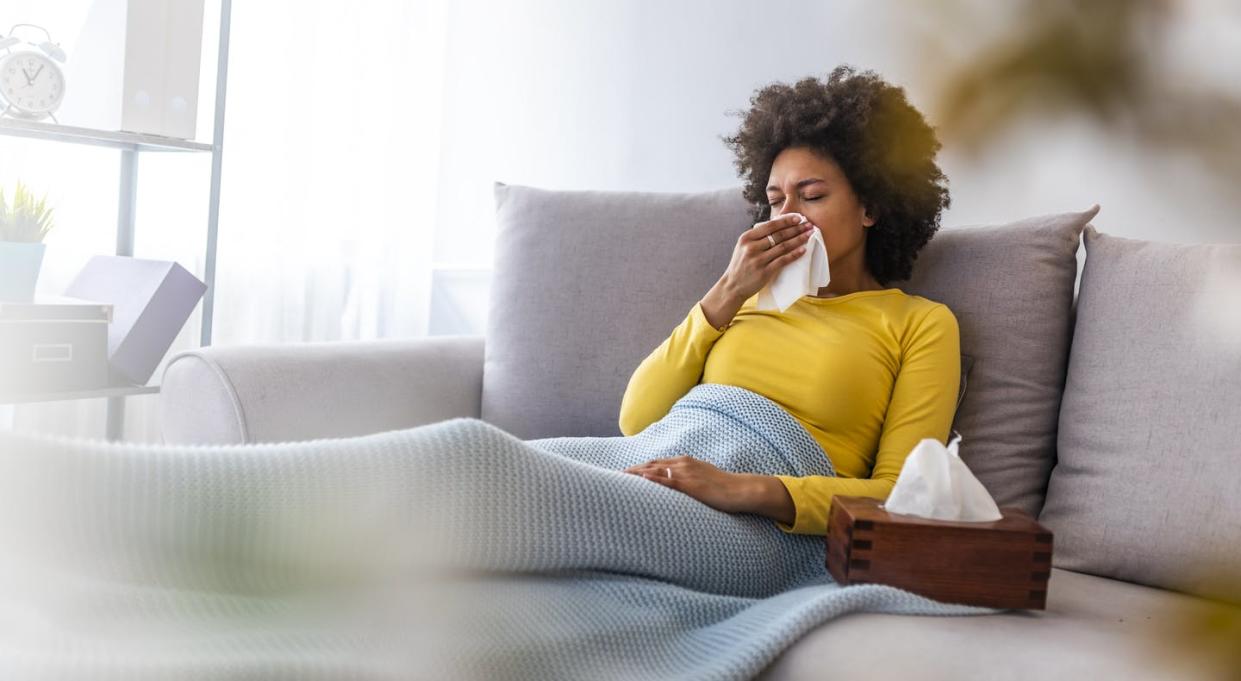 <span class="caption">Some people can still get sick after getting vaccinated for COVID-19.</span> <span class="attribution"><a class="link " href="https://www.gettyimages.com/detail/photo/woman-sneezing-in-a-tissue-in-the-living-room-royalty-free-image/1149518691?adppopup=true" rel="nofollow noopener" target="_blank" data-ylk="slk:Dragana991/iStock via Getty Images Plus;elm:context_link;itc:0;sec:content-canvas">Dragana991/iStock via Getty Images Plus</a></span>