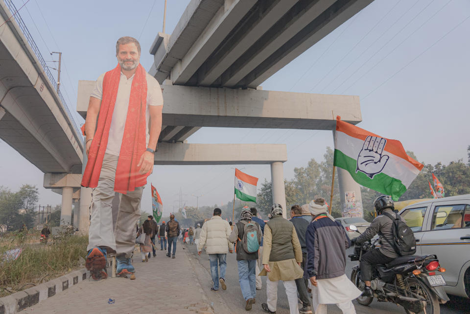 Supporters of Indian National Congress walk by a cut-out of Rahul Gandhi early in the morning to see him during the Bharat Jodo Yatra in New Delhi, India on Dec. 24, 2022.<span class="copyright">Ronny Sen for TIME</span>