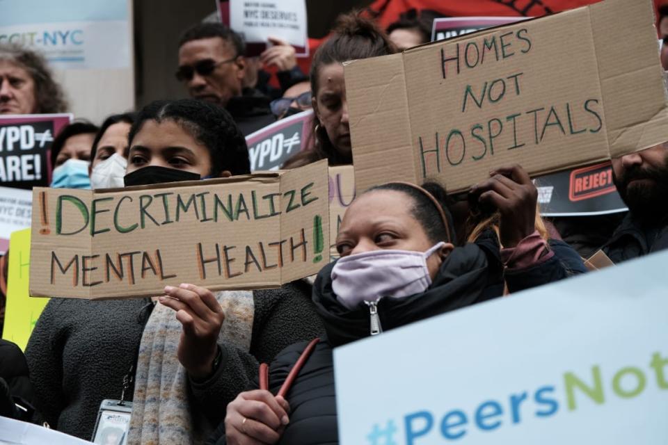 Advocates display signs at a mental health rally. (Photo by Spencer Platt/Getty Images_