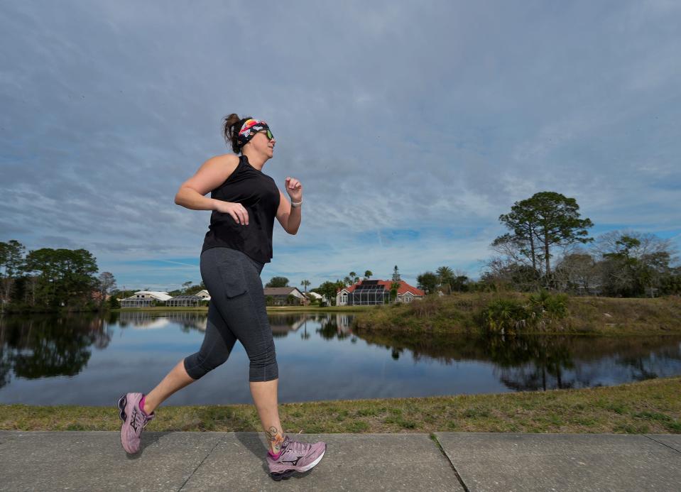 Sarah Callahan runs in Daytona Beach, Saturday, Feb. 10, 2024, in preparation for the New York City Half Marathon.