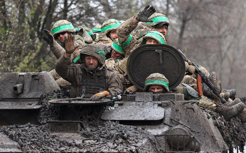 Ukrainian servicemen return from heavy fighting near Bakhmut on Saturday (Reuters)
