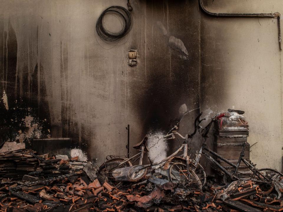 Houses were burned in a wildfire in the village of Kastri on Evia in August (AFP via Getty Images)