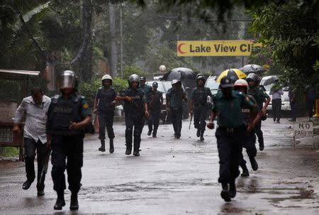 Policemen patrol on the road leading to the Holey Artisan Bakery and the O'Kitchen Restaurant after gunmen attacked, in Dhaka, Bangladesh, July 3, 2016. REUTERS/Adnan Abidi