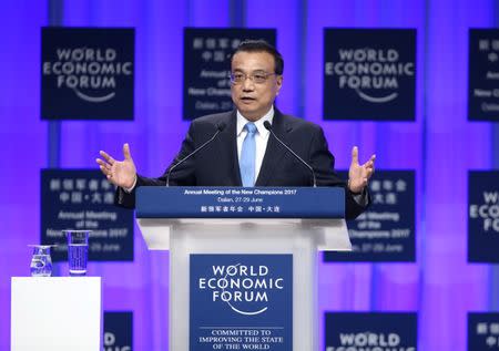 Chinese Premier Li Keqiang delivers an opening speech at the World Economic Forum in Dalian, Liaoning province, China June 27, 2017. CNS/Liu Zhen via REUTERS