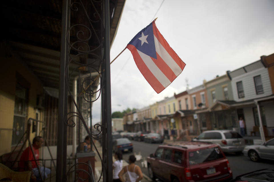 A Puerto Rican flag flies in North Philadelphia in 2018. Pennsylvania was a top destination for Puerto Ricans leaving the island after Hurricane Maria in 2017. (Photo: Mark Makela/The Washington Post via Getty Images)