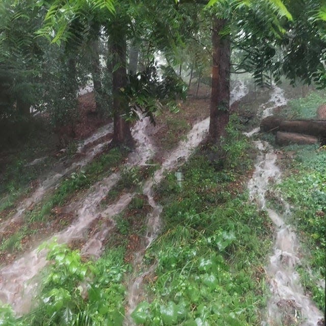 Flood waters pour down from Mt. Eyre Road in Lower Makefield on Saturday, July 15, 2023.